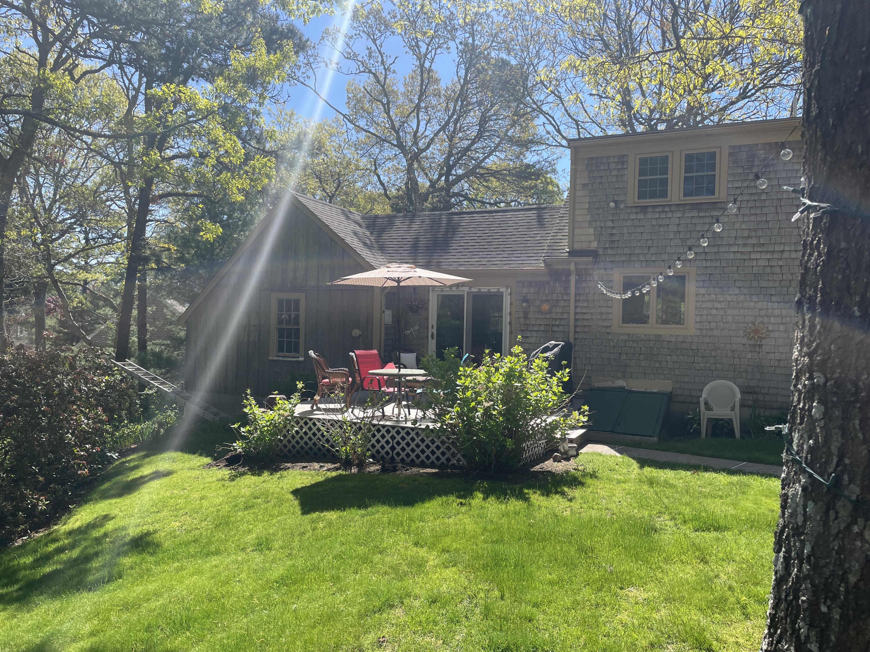 14 Oxner Road Centerville, MA 02632 - Photo 42 of 60 a view of a garden with a flower garden