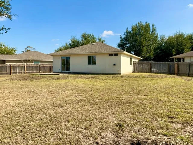 a backyard of a house with lots of green space