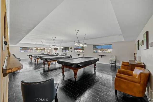 a living room with furniture a rug and a chandelier