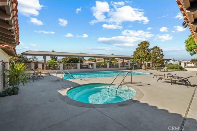 a view of a swimming pool with a patio