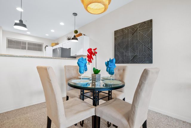 a view of a dining room with furniture