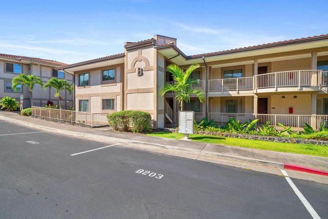 a front view of a building with garden