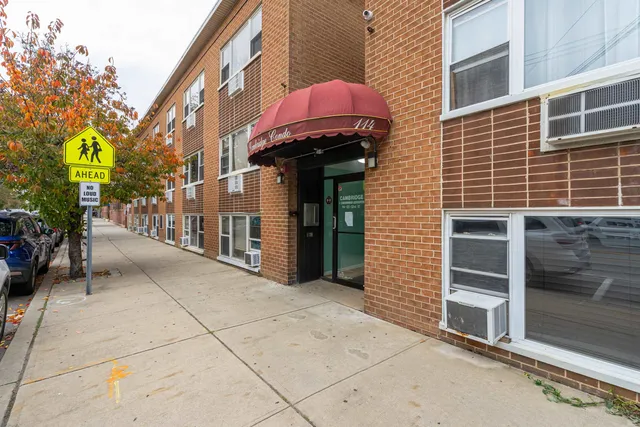 a view of a brick building with many windows