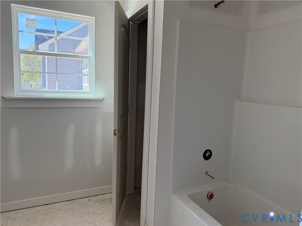 21305 Rutledge Avenue Petersburg, VA 23803 - Photo 6 of 14 a bathroom with a bathtub and a shower