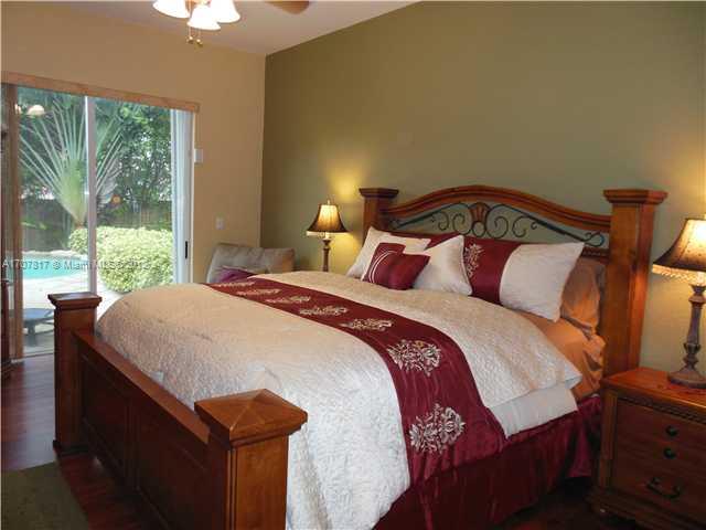 Keys Gate Homestead, FL 33035 - Photo 2 of 11 a bedroom with a bed and window