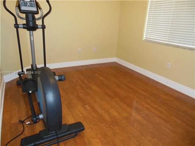 Keys Gate Homestead, FL 33035 - Photo 7 of 11 a view of a room with gym equipment