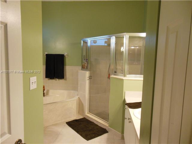 Keys Gate Homestead, FL 33035 - Photo 8 of 11 a bathroom with a shower and a toilet