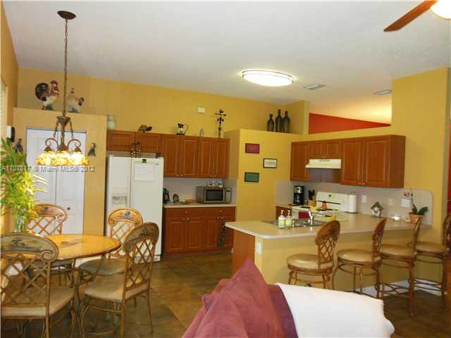 Keys Gate Homestead, FL 33035 - Photo 10 of 11 a view of a dining room with furniture