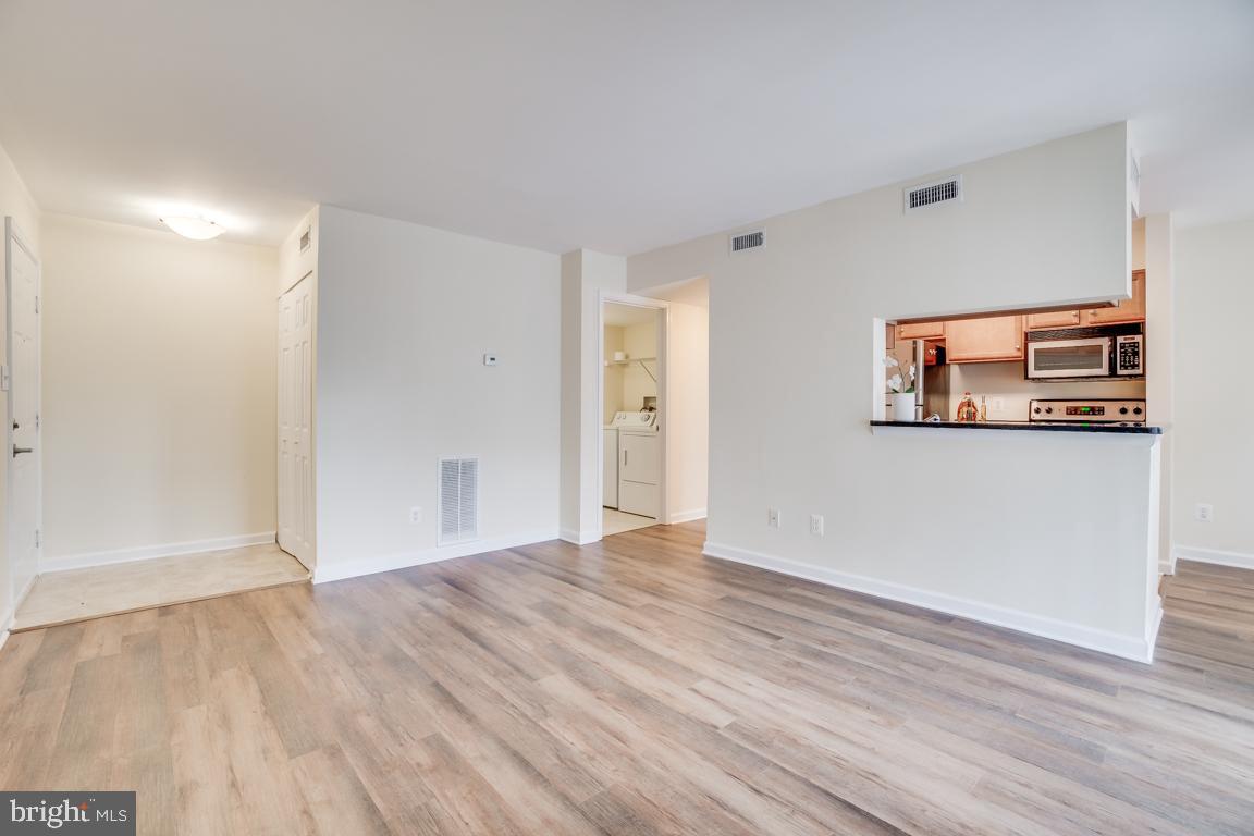 1706 Ascot Way, Unit B Reston, VA 20190 - Photo 2 of 23 Step into your bright and airy living room.