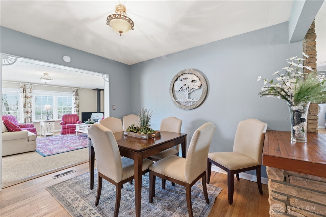 2945 Ashlar Drive Springfield, OH 45503 - Photo 8 of 20 This dining area showcases elegant wood flooring and a classic lighting fixture.