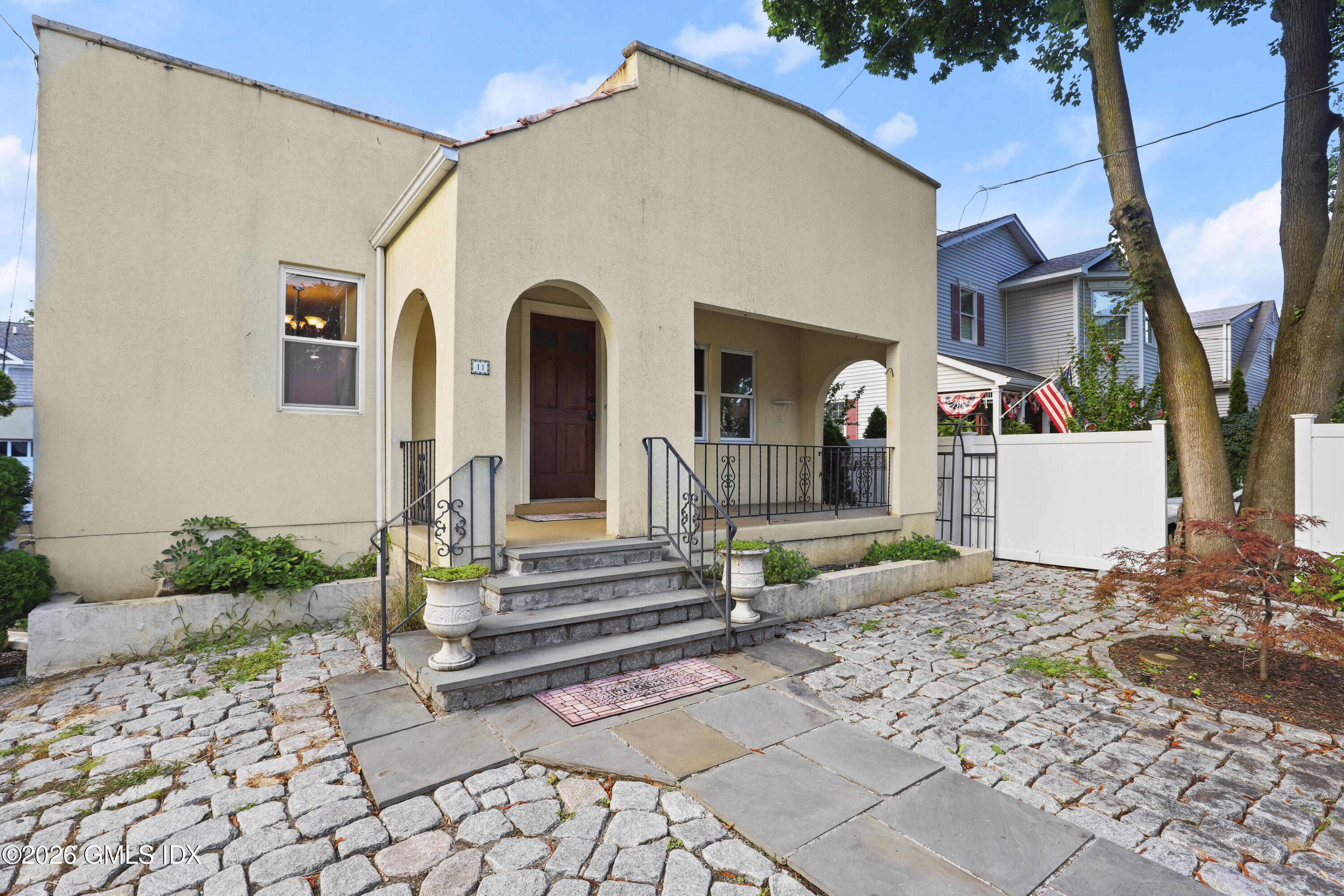 11 Rex Street Greenwich, CT 06831 - Photo 1 of 22 a front view of a house with garden