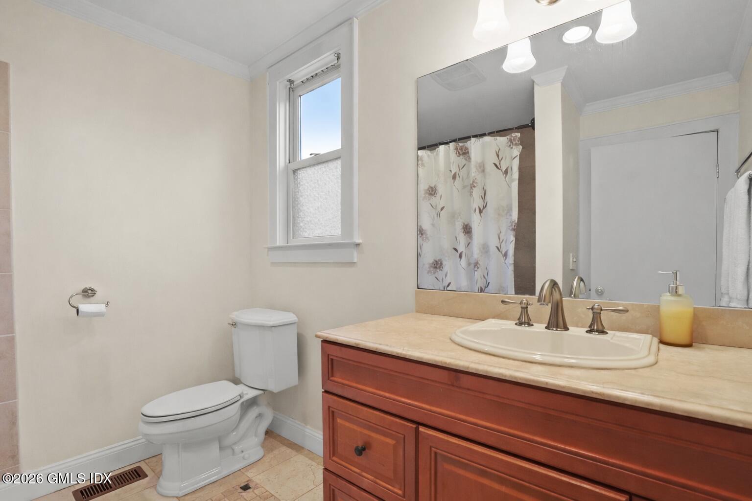 11 Rex Street Greenwich, CT 06831 - Photo 11 of 22 a bathroom with a granite countertop sink toilet and mirror