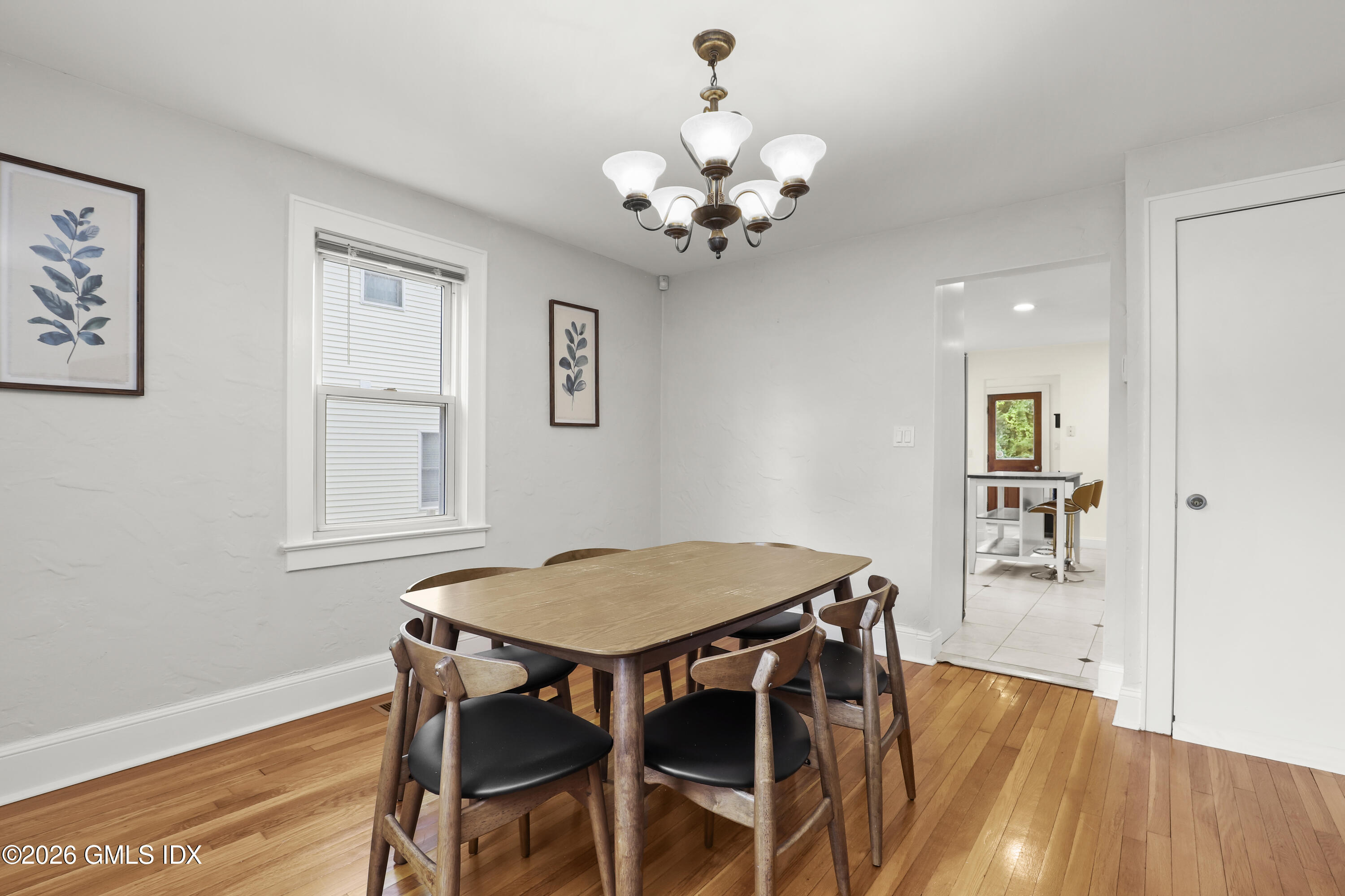 11 Rex Street Greenwich, CT 06831 - Photo 8 of 22 a view of a dining room with furniture and wooden floor