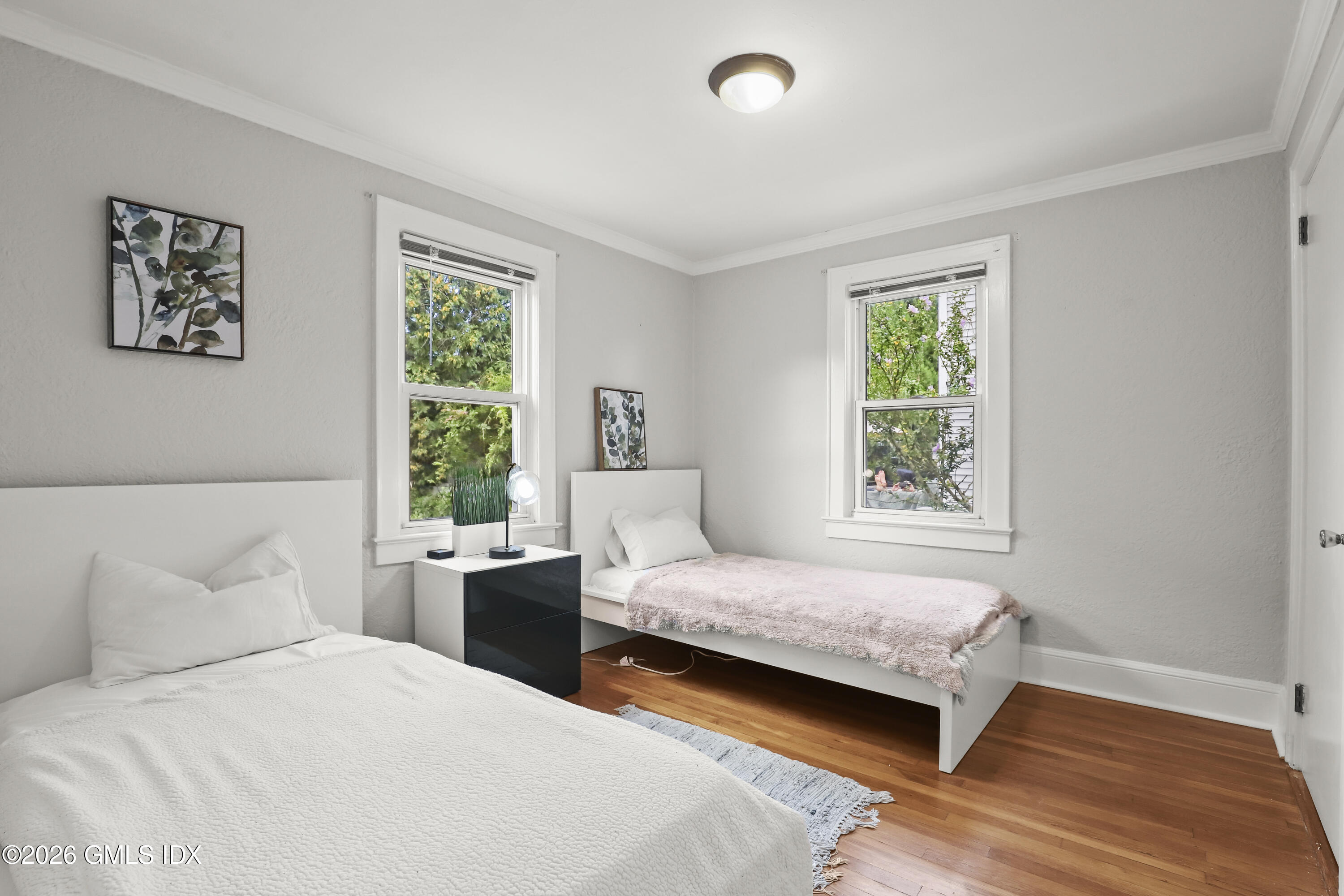 11 Rex Street Greenwich, CT 06831 - Photo 10 of 22 a bedroom with two beds and a window
