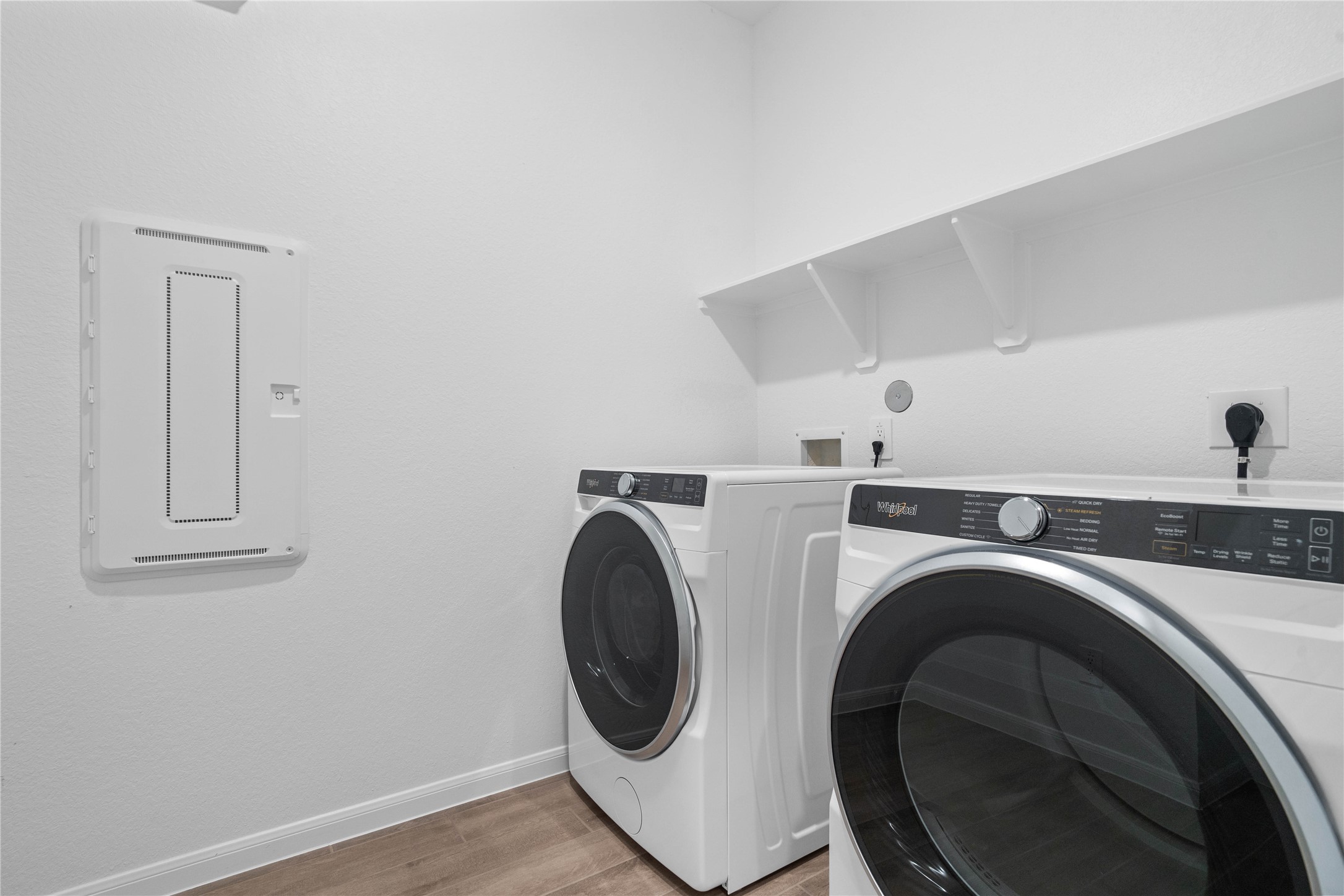 19645 Montgomery Rdg Way Montgomery, TX 77316 - Photo 12 of 41 This dedicated laundry room comes equipped with a washer and dryer set, ready for immediate use.