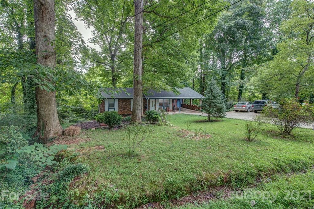 647 Blacksnake Road Stanley, NC 28164 - Photo 2 of 35 a front view of a house with garden