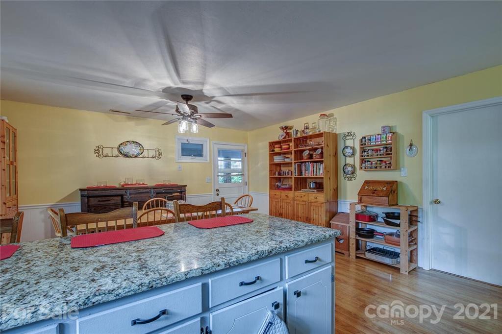 647 Blacksnake Road Stanley, NC 28164 - Photo 12 of 35 a living room with couch and a bookshelf