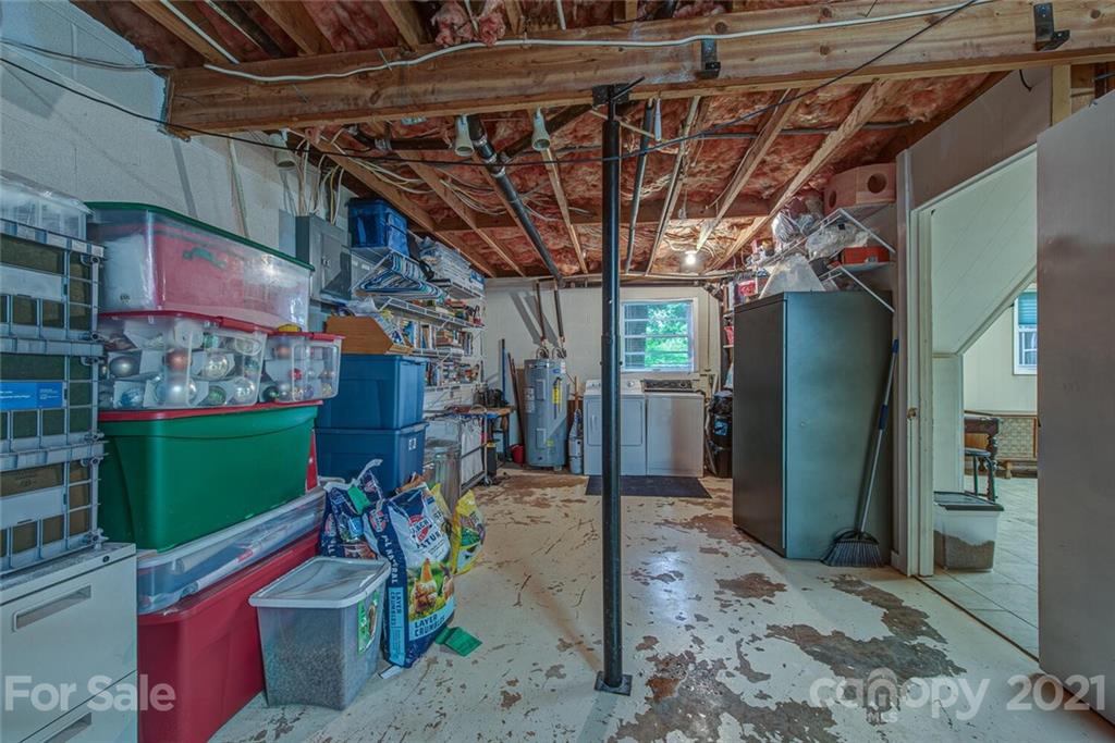647 Blacksnake Road Stanley, NC 28164 - Photo 27 of 35 a view of a garage with a table and chairs