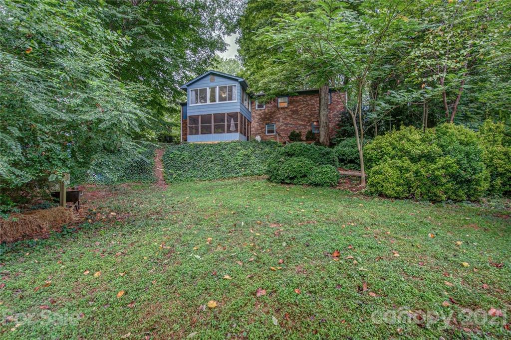 647 Blacksnake Road Stanley, NC 28164 - Photo 30 of 35 a view of a house with a yard and large trees