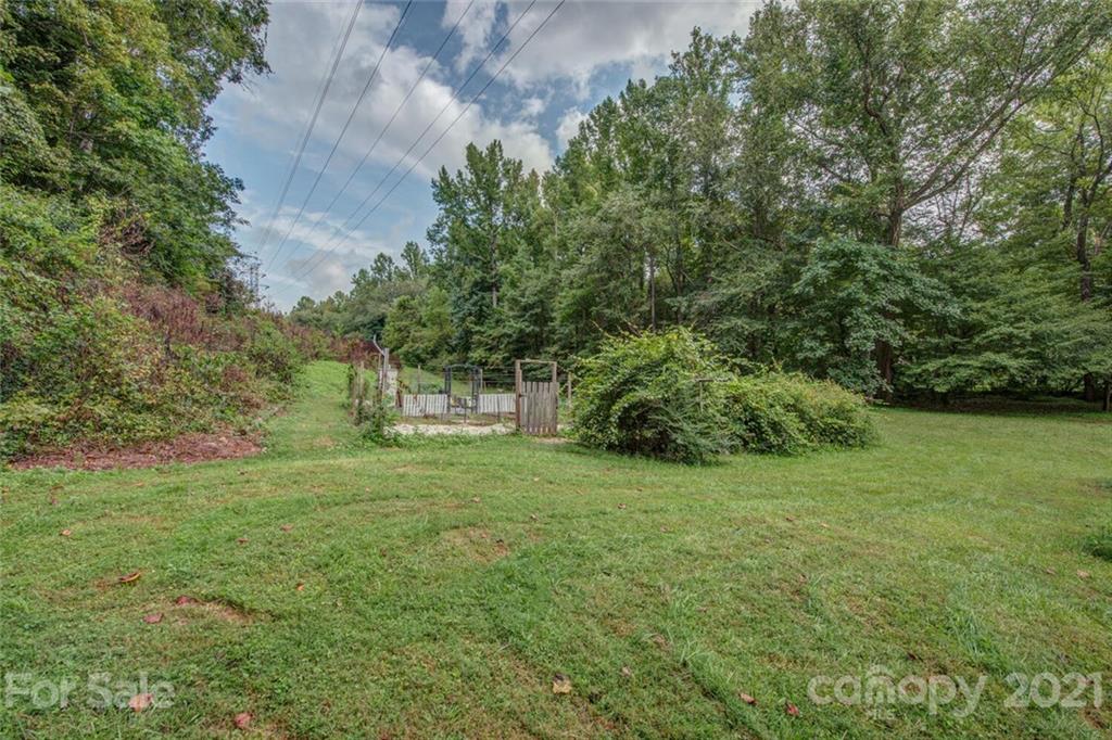 647 Blacksnake Road Stanley, NC 28164 - Photo 33 of 35 a view of a trees with a yard
