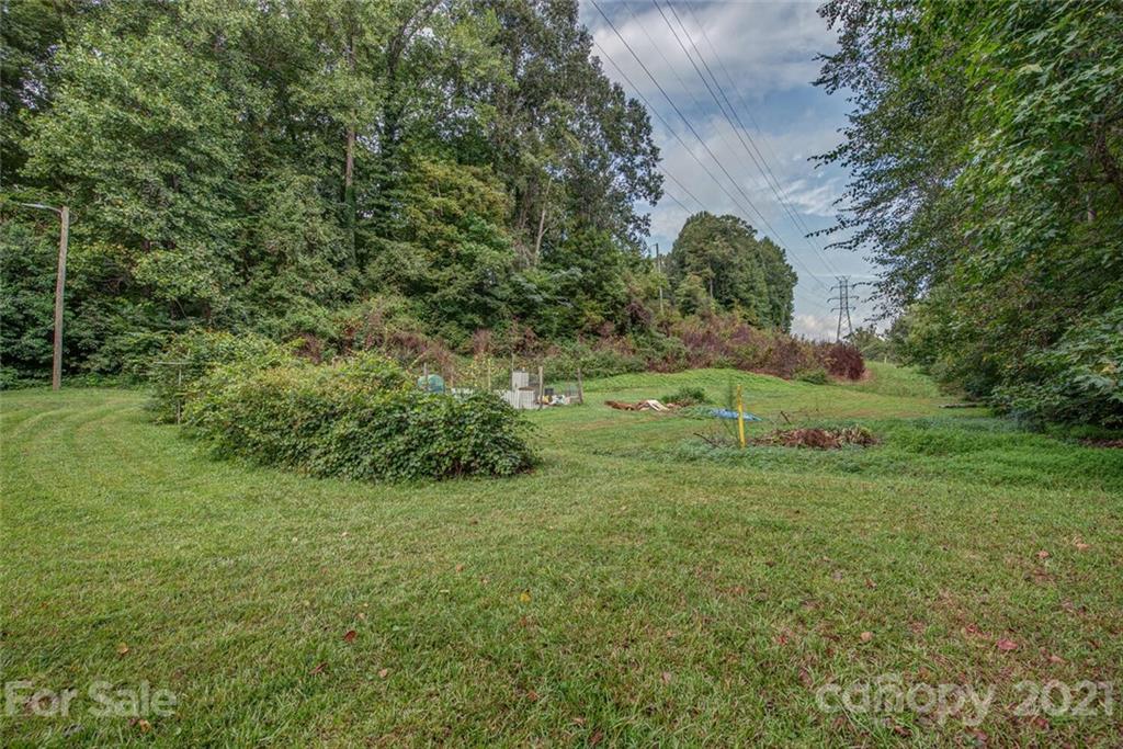647 Blacksnake Road Stanley, NC 28164 - Photo 34 of 35 a view of a field with a tree