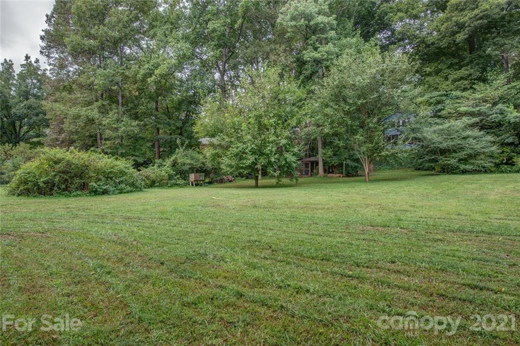 647 Blacksnake Road Stanley, NC 28164 - Photo 35 of 35 a view of a green field with wooden fence