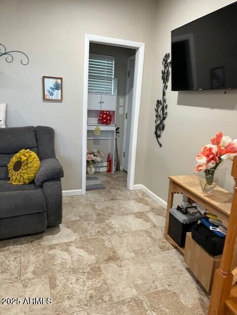 702 South Meridian Road, Unit 52 Apache Junction, AZ 85120 - Photo 10 of 20 a living room with furniture and a flat screen tv