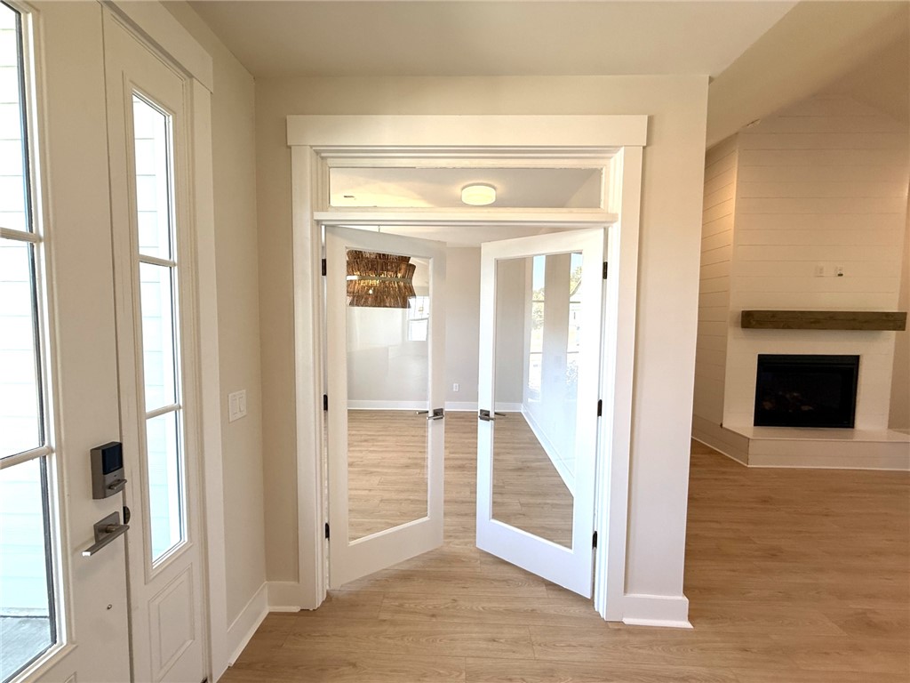 504 Tilman Court Anderson, SC 29621 - Photo 5 of 28 This inviting entryway leads to a living area with a fireplace, creating a warm and welcoming ambiance.