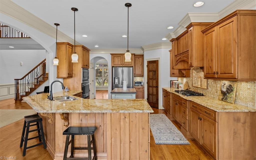 7787 Sutter Road Greensboro, NC 27455 - Photo 12 of 50 Rich cabinetry throughout