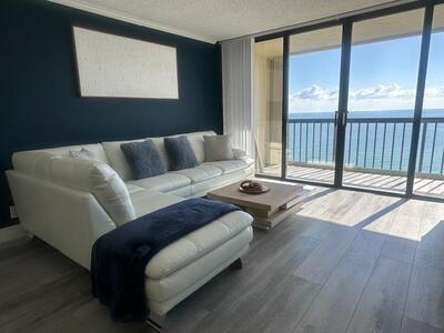 9500 South Ocean Drive, Unit 1909 Jensen Beach, FL 34957 - Photo 12 of 40 a living room with furniture and a floor to ceiling window