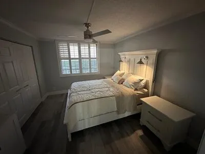 a bedroom with a bed and window