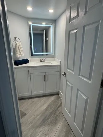 a bathroom with a sink and mirror
