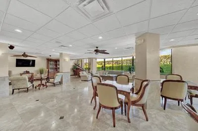 a room with furniture and pool table