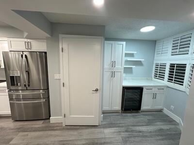 9500 South Ocean Drive, Unit 1909 Jensen Beach, FL 34957 - Photo 4 of 40 a kitchen with stainless steel appliances a refrigerator and a stove top oven