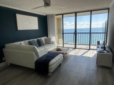 9500 South Ocean Drive, Unit 1909 Jensen Beach, FL 34957 - Photo 10 of 40 a living room with furniture and a large window