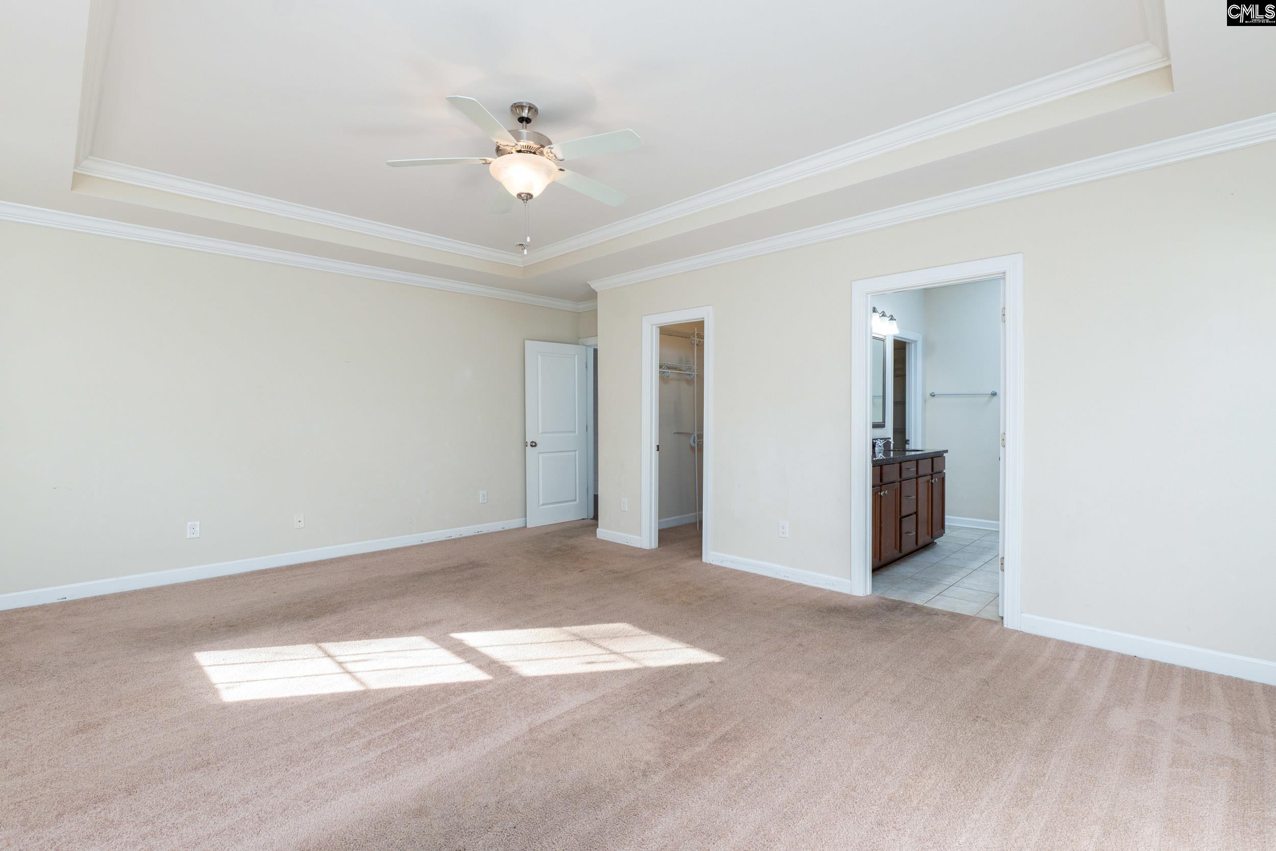 40 Wading Bird Loop Blythewood, SC 29016 - Photo 11 of 26 a view of an empty room with a chandelier fan