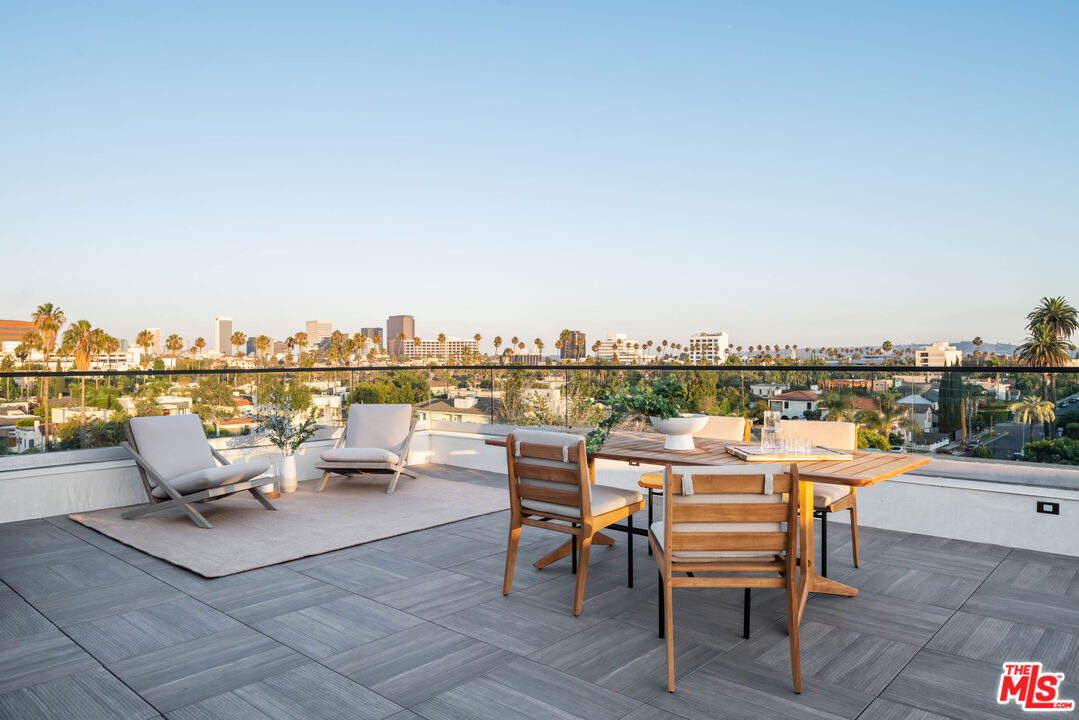 a view of a terrace with furniture