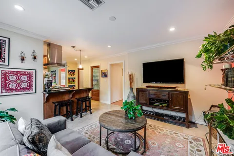 a bathroom with a granite countertop sink a toilet and bathtub