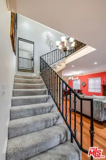 a view of a livingroom with workspace and a window