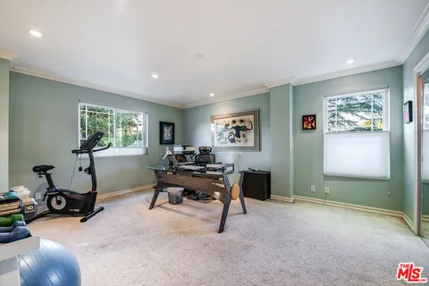 a bedroom with a bed and furniture