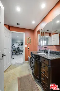 a bedroom with furniture and a bed