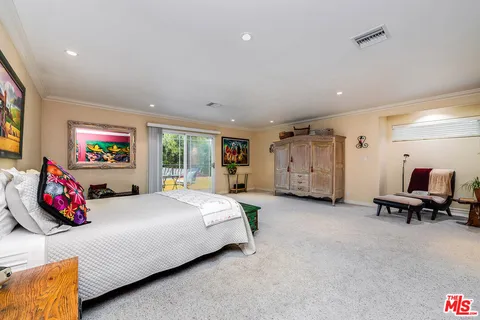 an aerial view of residential houses and car parked on street side