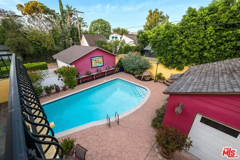 an aerial view of a house with a yard and outdoor space