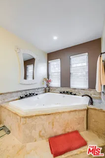 a front view of a house with a yard table and chairs