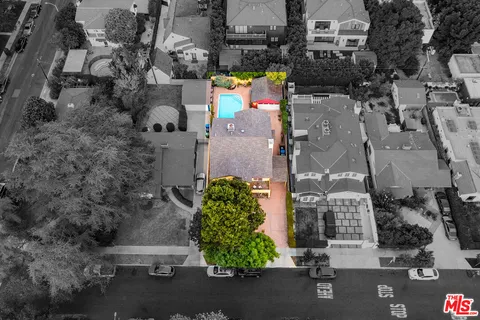 a house with swimming pool in front of it