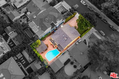 a backyard of a house with yard and furniture