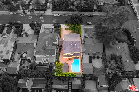 a view of a swimming pool with an outdoor space and seating area