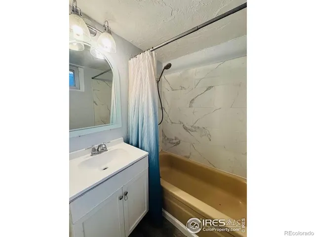 a view of a patio with table and chairs and potted plants