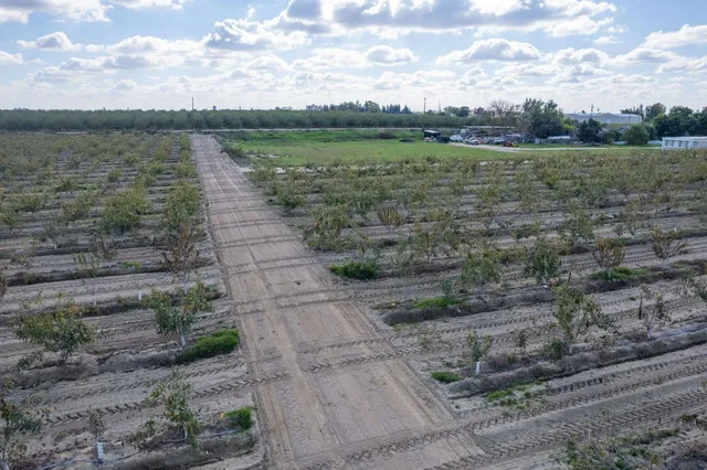 a view of a lake with a yard
