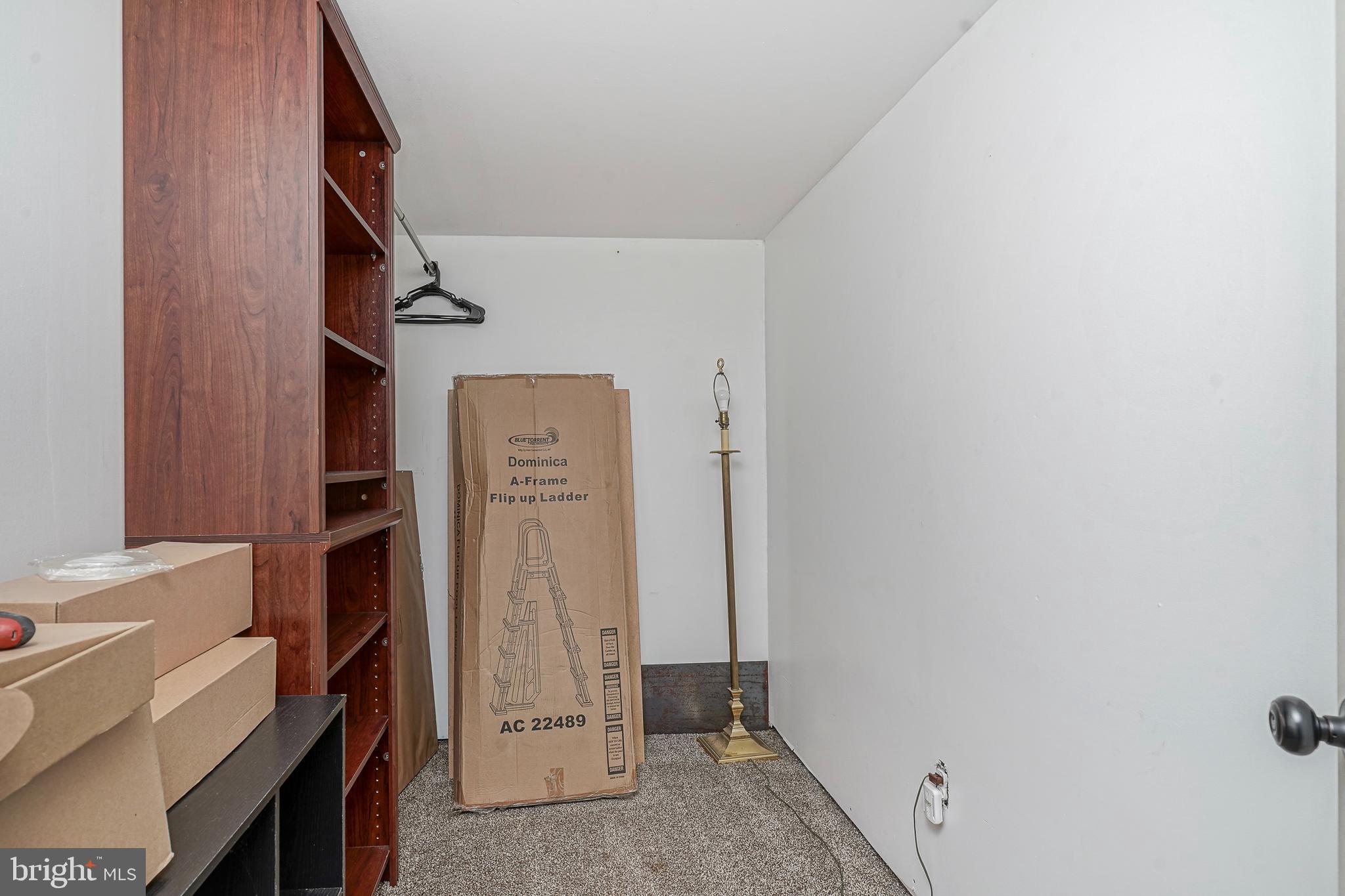 1304 Morgan Road Williamstown, NJ 08094 - Photo 17 of 32 a view of walk in closet with clothes and shoes